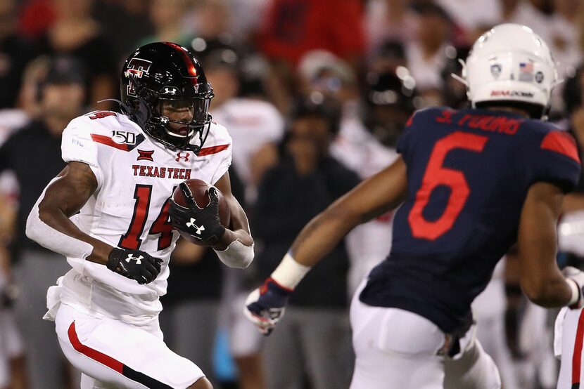 TUCSON, ARIZONA - SEPTEMBER 14:  Wide receiver Xavier White #14 of the Texas Tech Red...