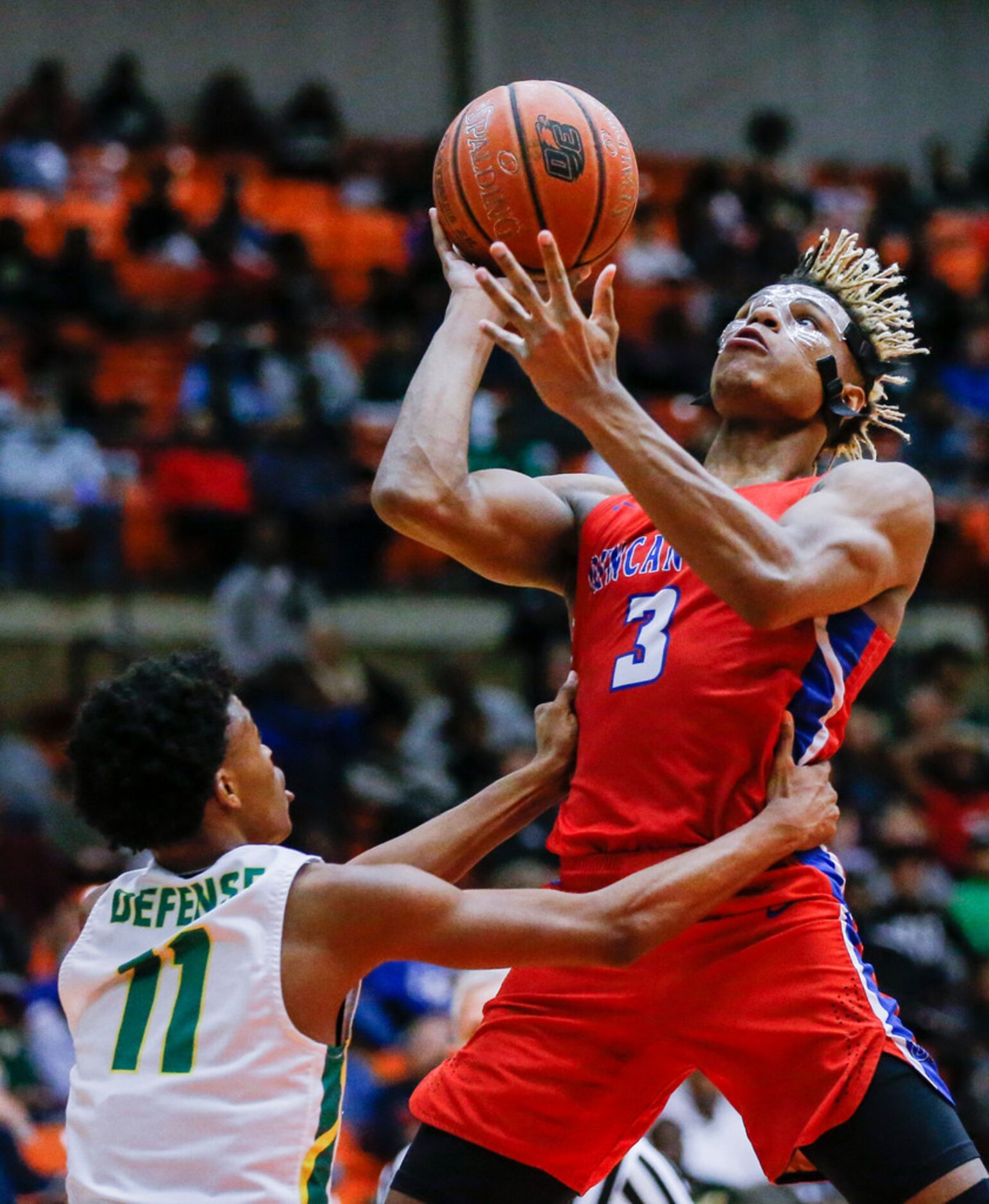 Duncanville senior guard Jahmi'us Ramsey (3) attempts a shot as DeSoto senior guard Chris...