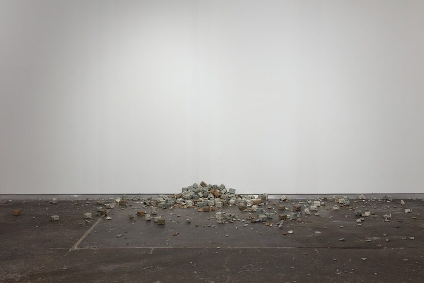 The broken cobblestones of Alicja Kwade's TonSteineScherben suggest the gesture of...