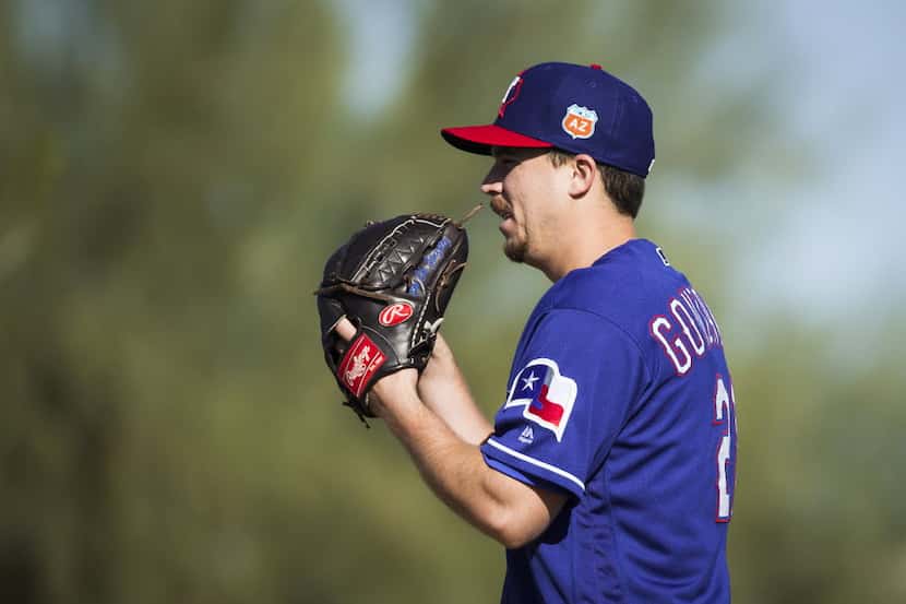Texas Rangers pitcher Chi Chi Gonzalez participates in a fielding drill during a spring...