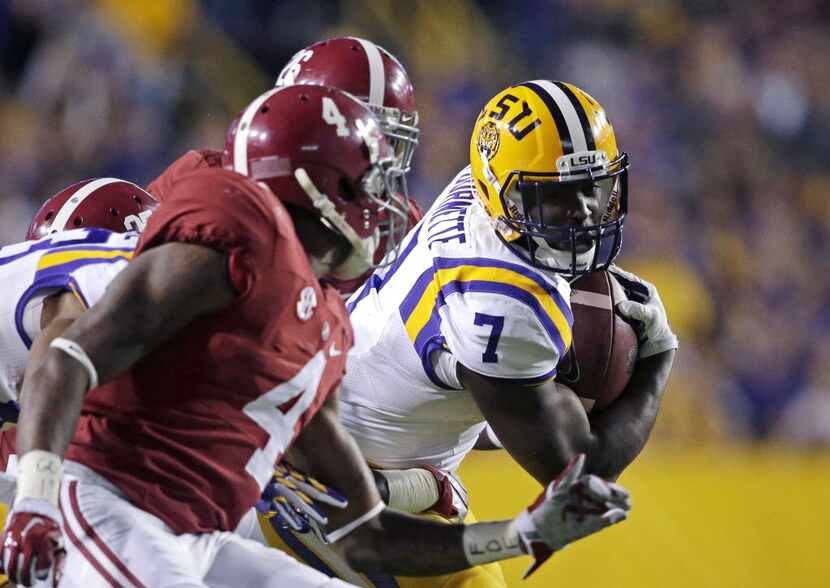 FILE - In this Nov. 8, 2014, file photo, LSU running back Leonard Fournette (7) carries in...
