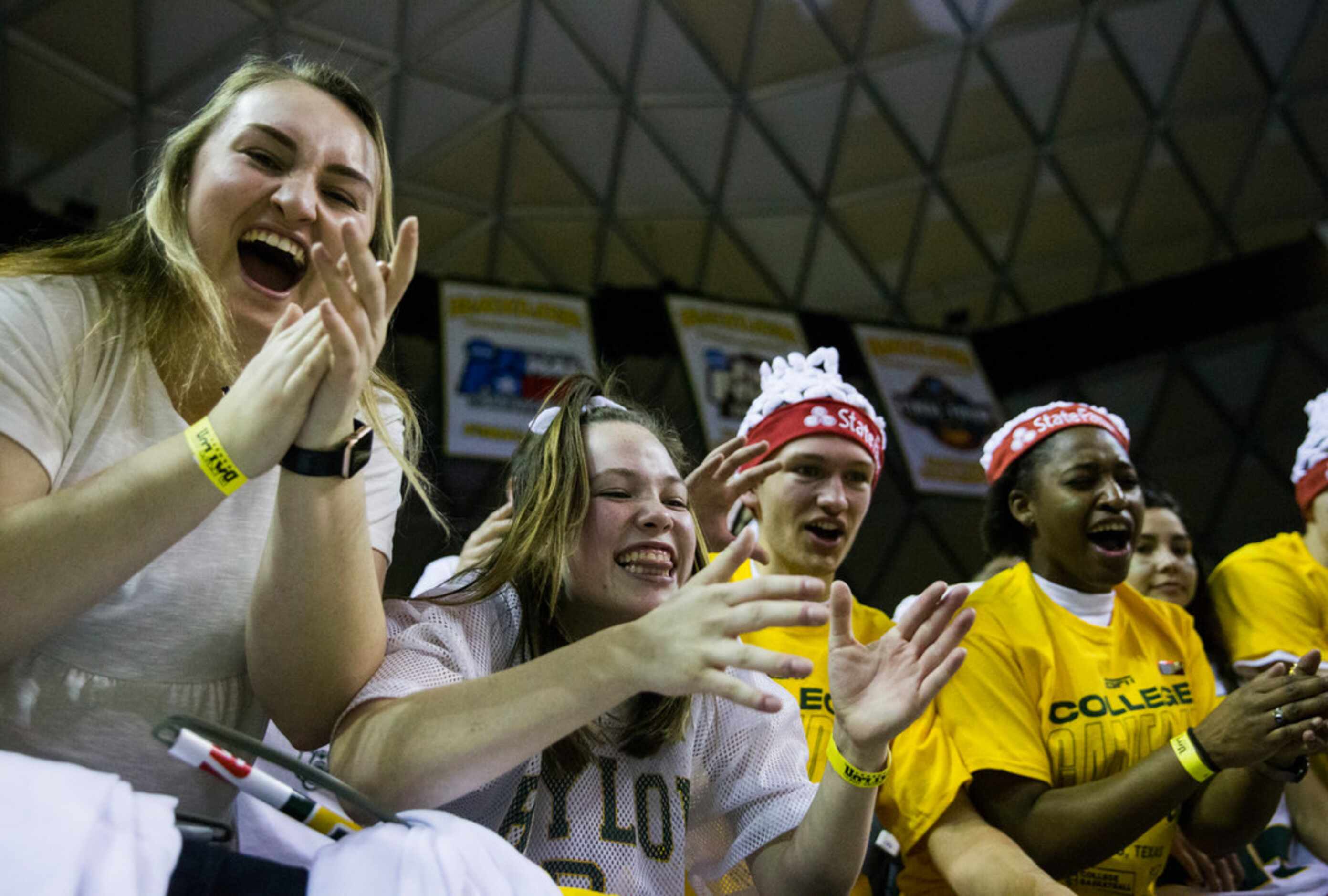 Baylor Bears fans cheer before an NCAA men's basketball game between Baylor University and...