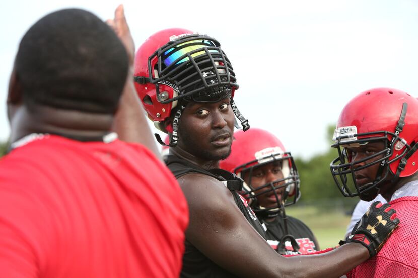 Cedar Hill Longhorns defensive lineman Shabazz Dotson was all ears (and eyes) as he takes in...