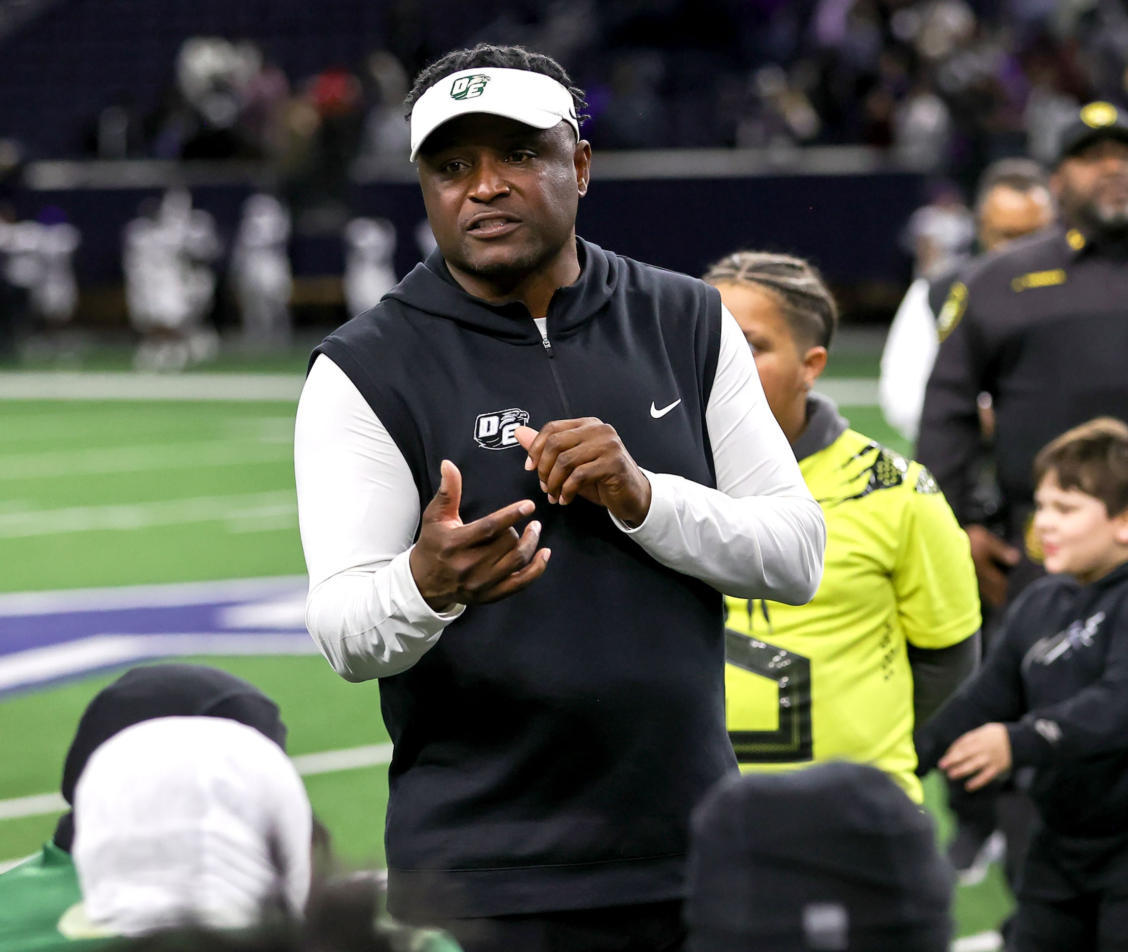 DeSoto head coach Claude Mathis talks to his team after beating Willis, 55-35 in a Class 6A...