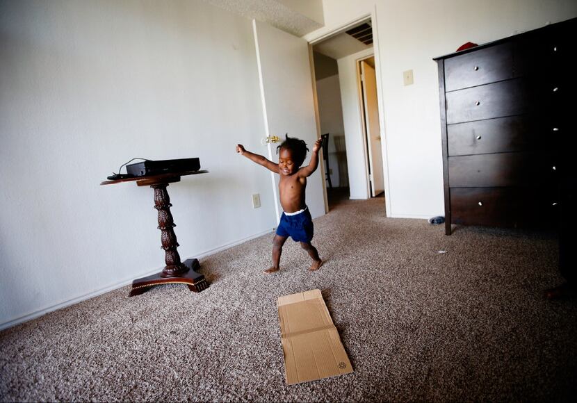 Jordan Miller runs in circles at his new apartment in Dallas. His father, Joshua Miller,...