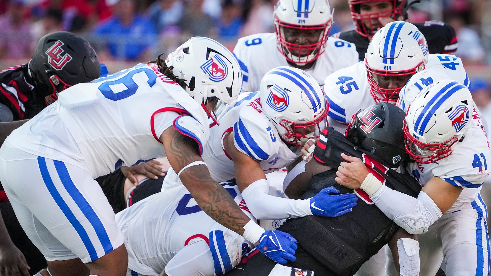 Lamar Cardinals running back Khalan Griffin (6) is smothered by SMU defensive tackle DeVere...