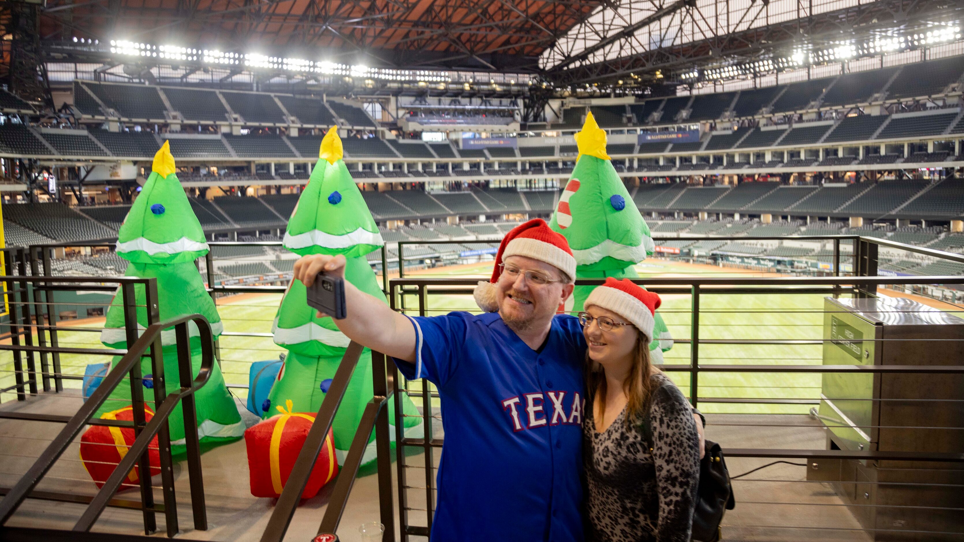 Carl Weber III and Brittany Weber of Crowley take a selfie during the Texas Rangers Toy...