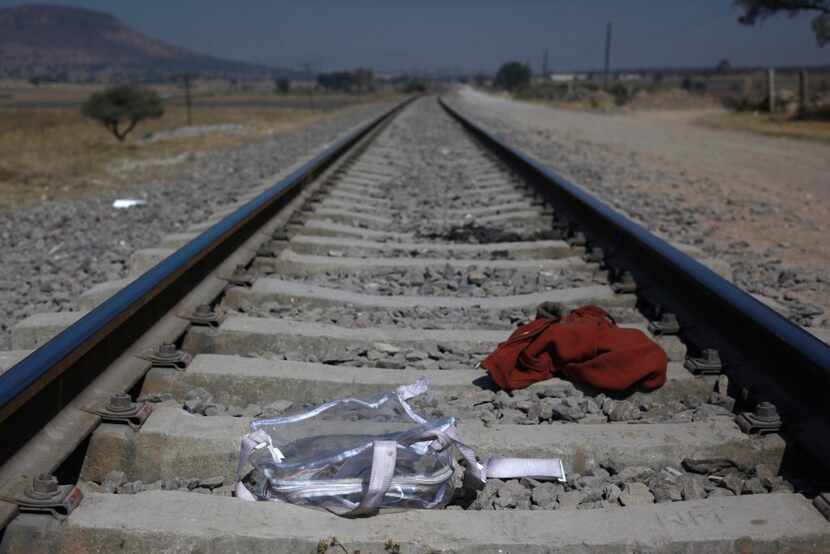 Central American migrants wait near these tracks of a northbound train. (AP Photo/Marco Ugarte)
