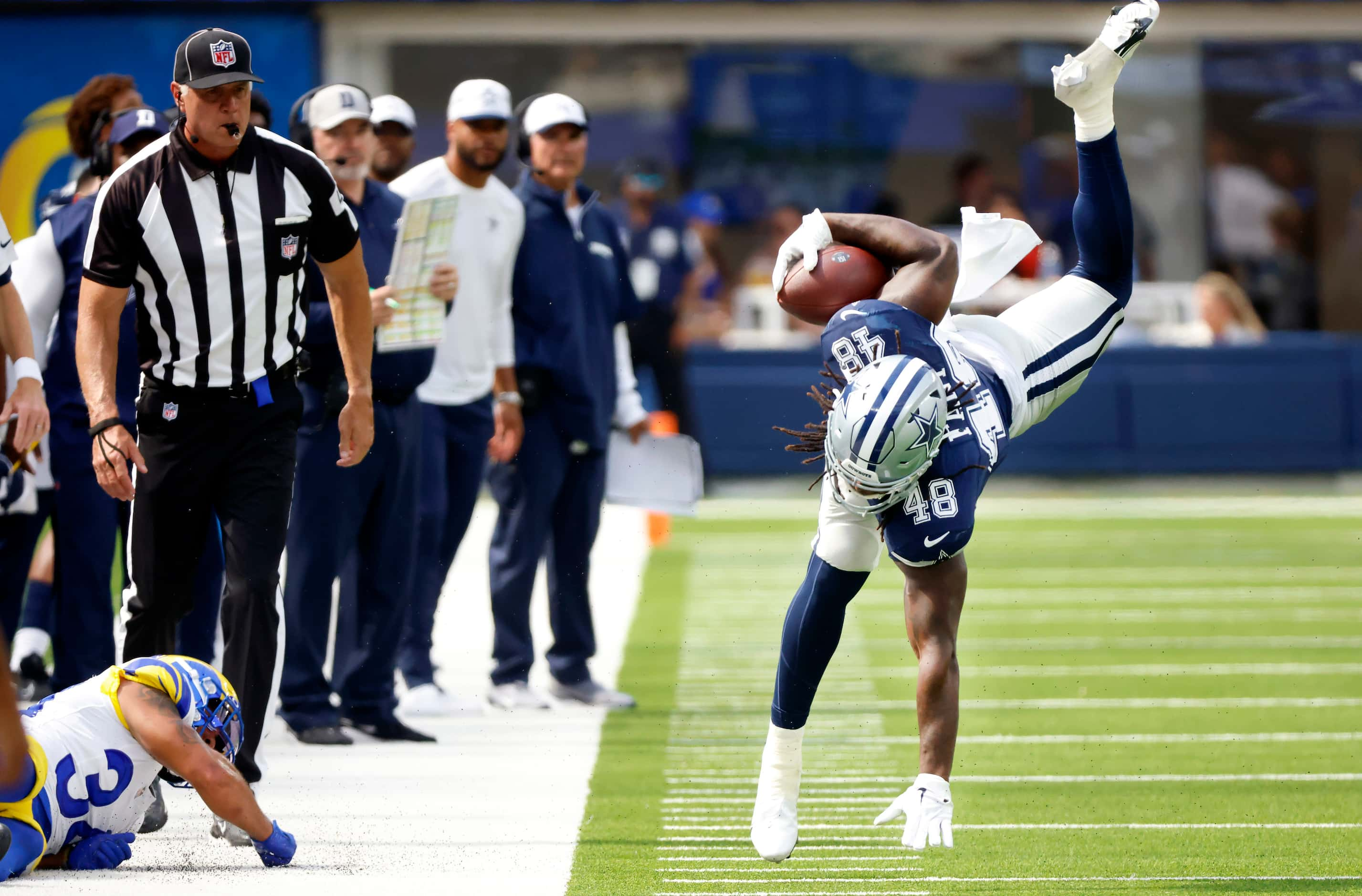 Dallas Cowboys tight end Princeton Fant (48) was upended as he tried to avoid the tackle by...