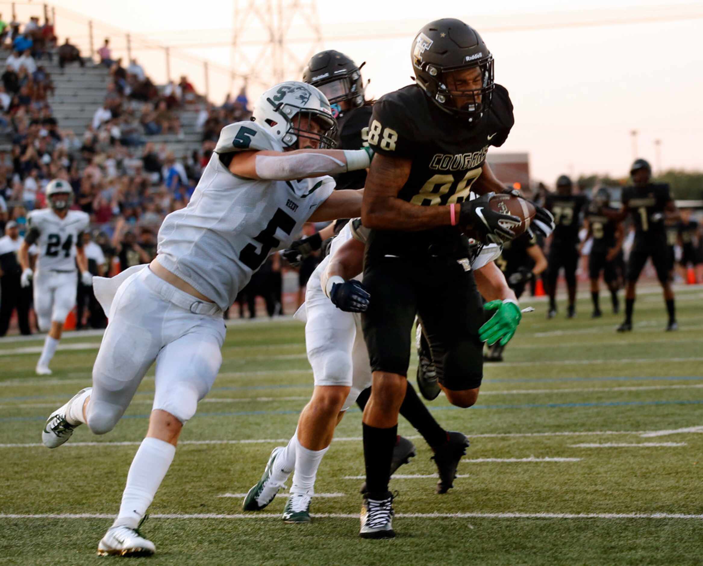 The Colony wide receiver Keith Miller III scores a first quarter touchdown as he was covered...