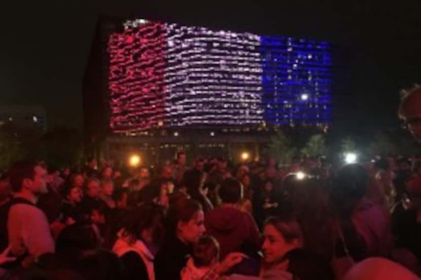  A group of about 200 gathered outside the Omni Hotel in downtown Dallas on Sunday night in...