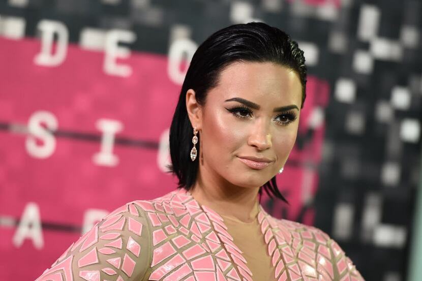 Demi Lovato arrives at the MTV Video Music Awards at the Microsoft Theater on Sunday, Aug....