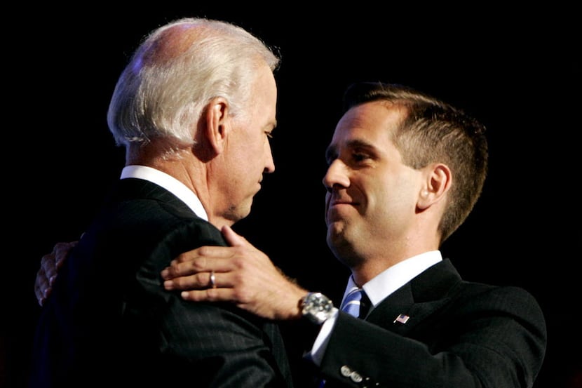 
Before his death May 30 from brain cancer, Beau Biden (right) reportedly urged his father,...