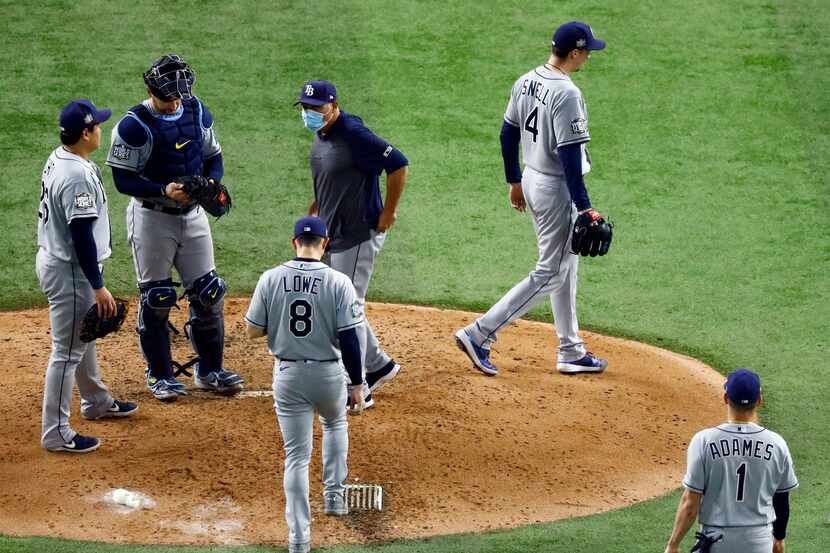Tampa Bay Rays starting pitcher Blake Snell (4) walks to the dugout after being pulled by...