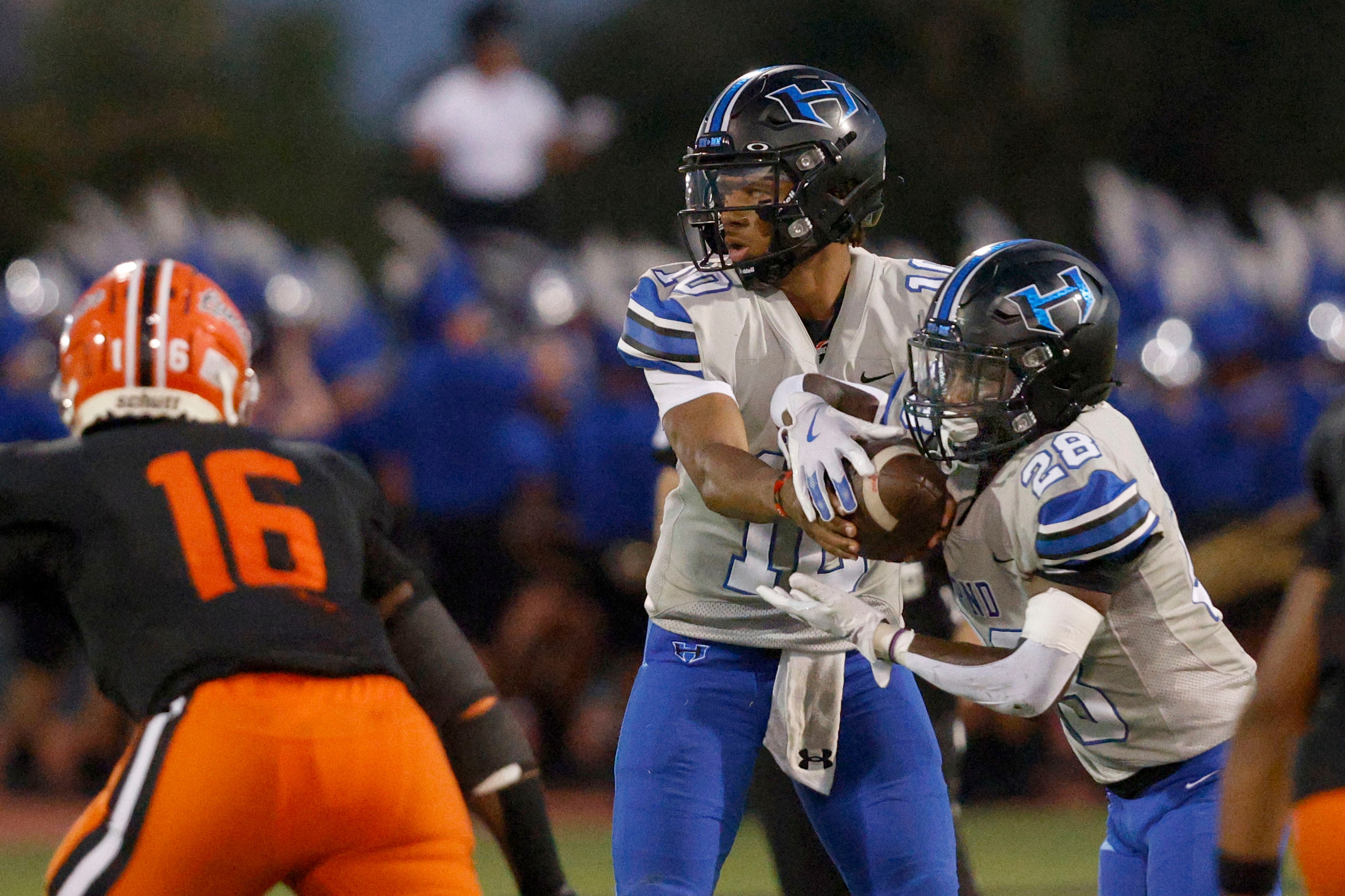 Hebron’s quarterback Patrick Crayton Jr. (10) hands off to Hebron’s Marcus Nathaniel-Johnson...