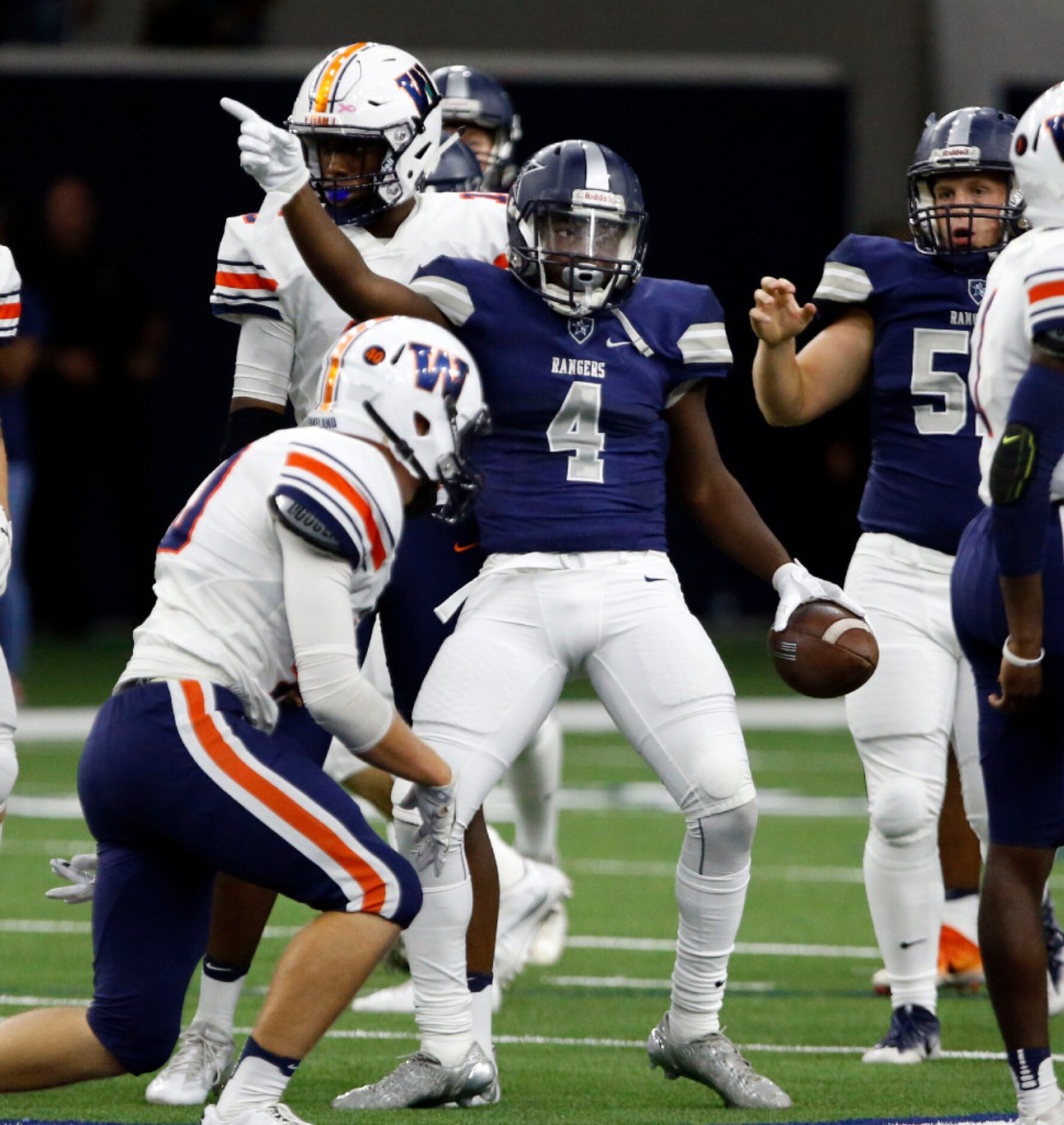 Frisco Lone Star's Darrin Smith (4) signals his first down during the first half of a high...