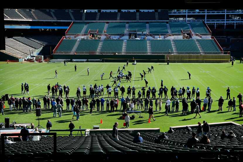 The XFL's Dallas Renegades football team practices before fans on the newly constructed...