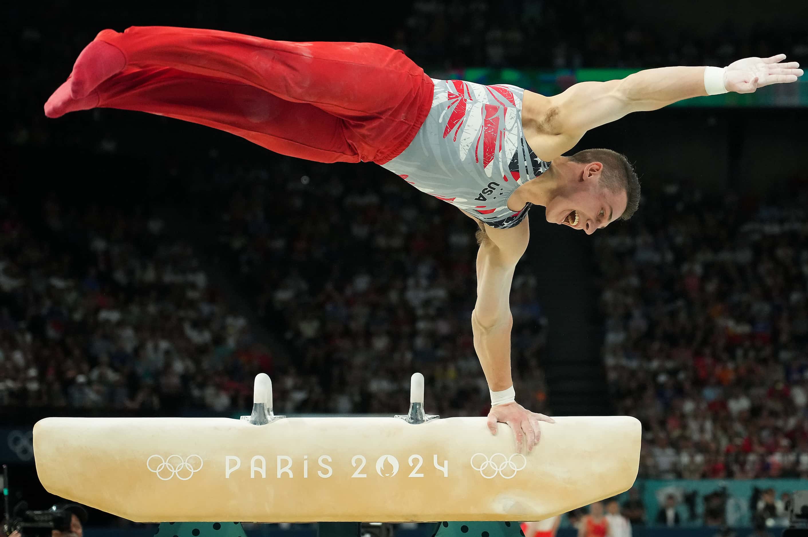 Paul Juda  of the United States competes on the pommel horse during the men’s gymnastics...