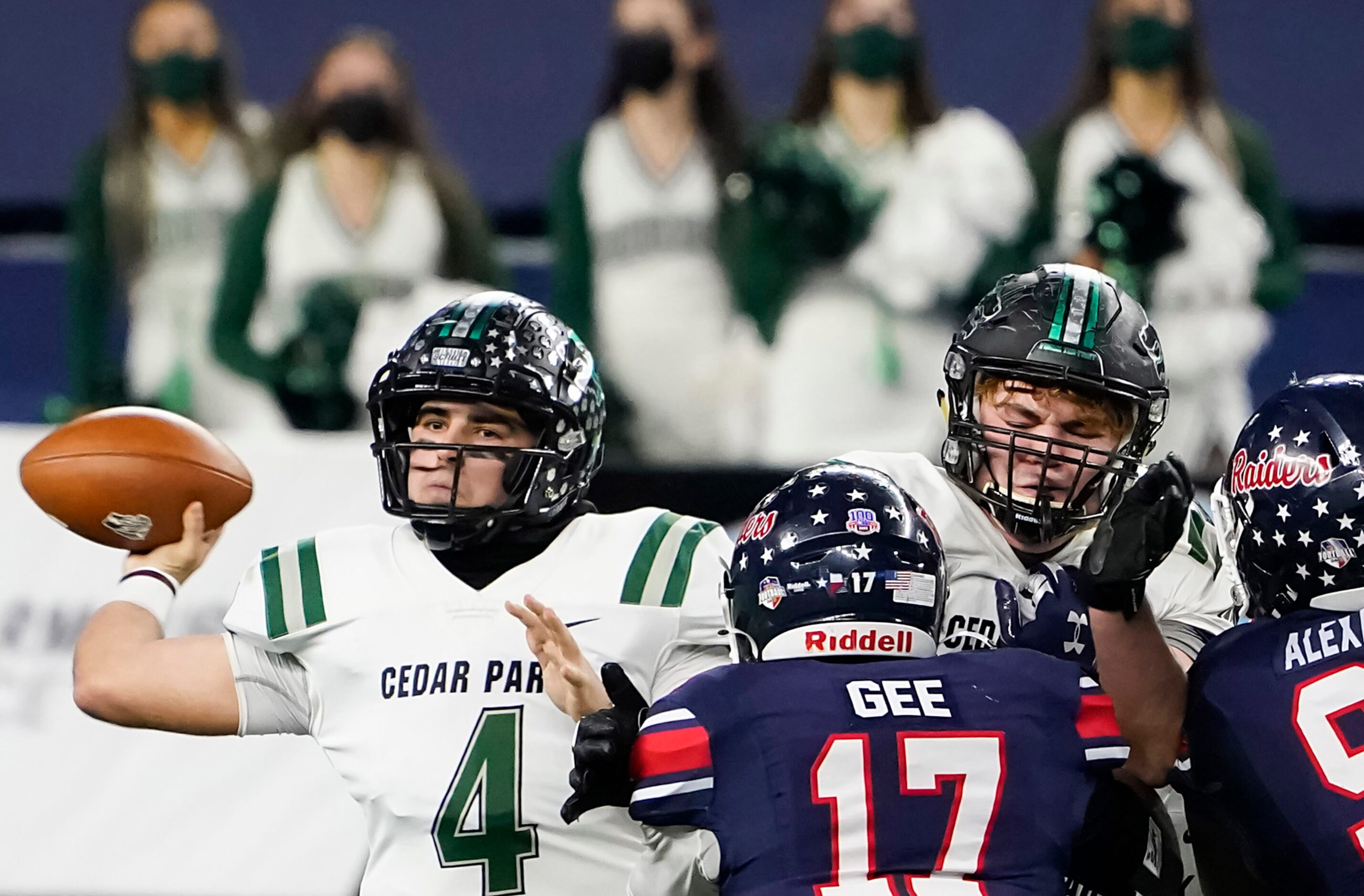 Cedar Park quarterback Ryder Hernandez (4) gets off a pass under pressure from Denton Ryan...