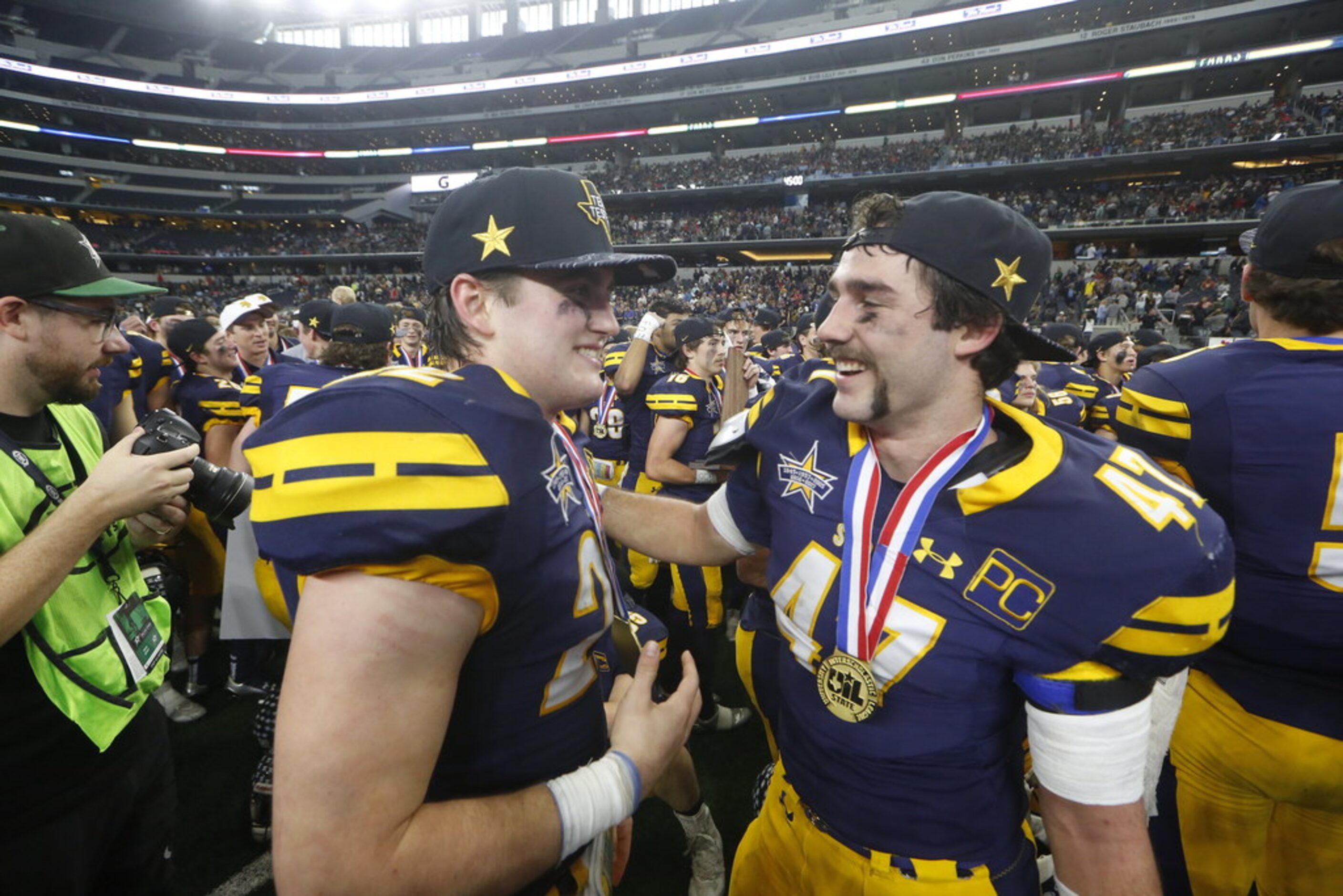 Highland Park's Benner Page (22) and Colby Hopkins (47)  celebrate beating Shadow Creek...