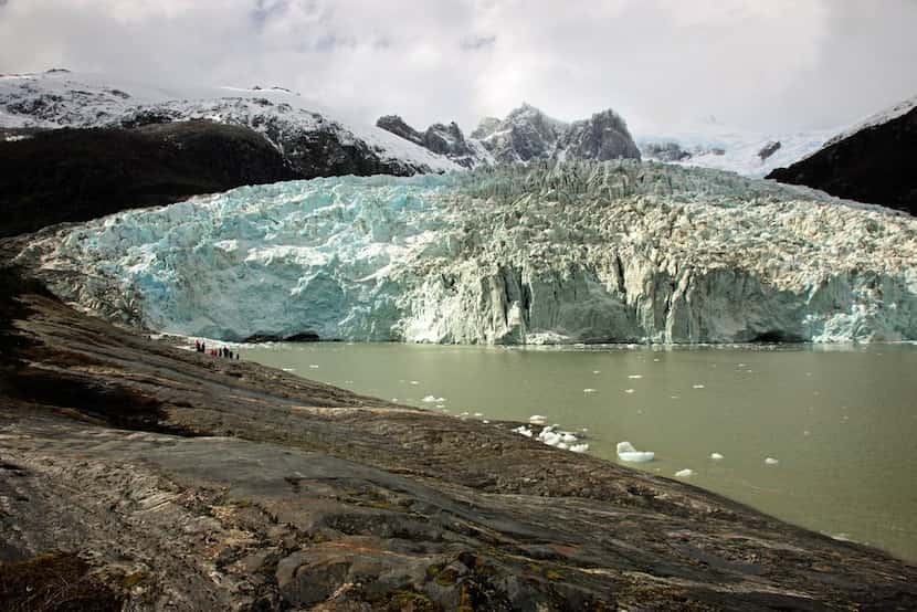 Hikers take in the view of one of many glaciers they'll get to see on daily outings during a...