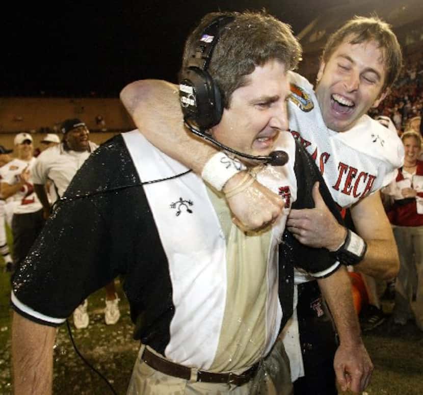 Texas Tech quarterback Kliff Kingsbury, right, celebrates with head coach Mike Leach after...