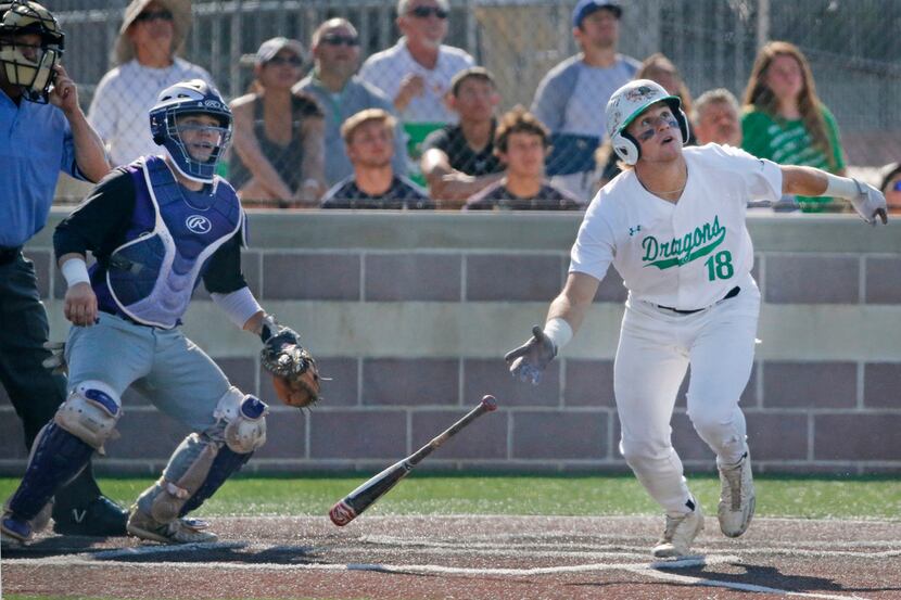 Southlake Carroll's Will Quillen (18) drives in the go-ahead run with a sacrifice fly during...