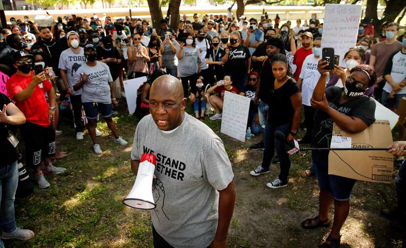 The Rev. Darell A. Smith leads the Community of Faith Gathering as they protested outside of...