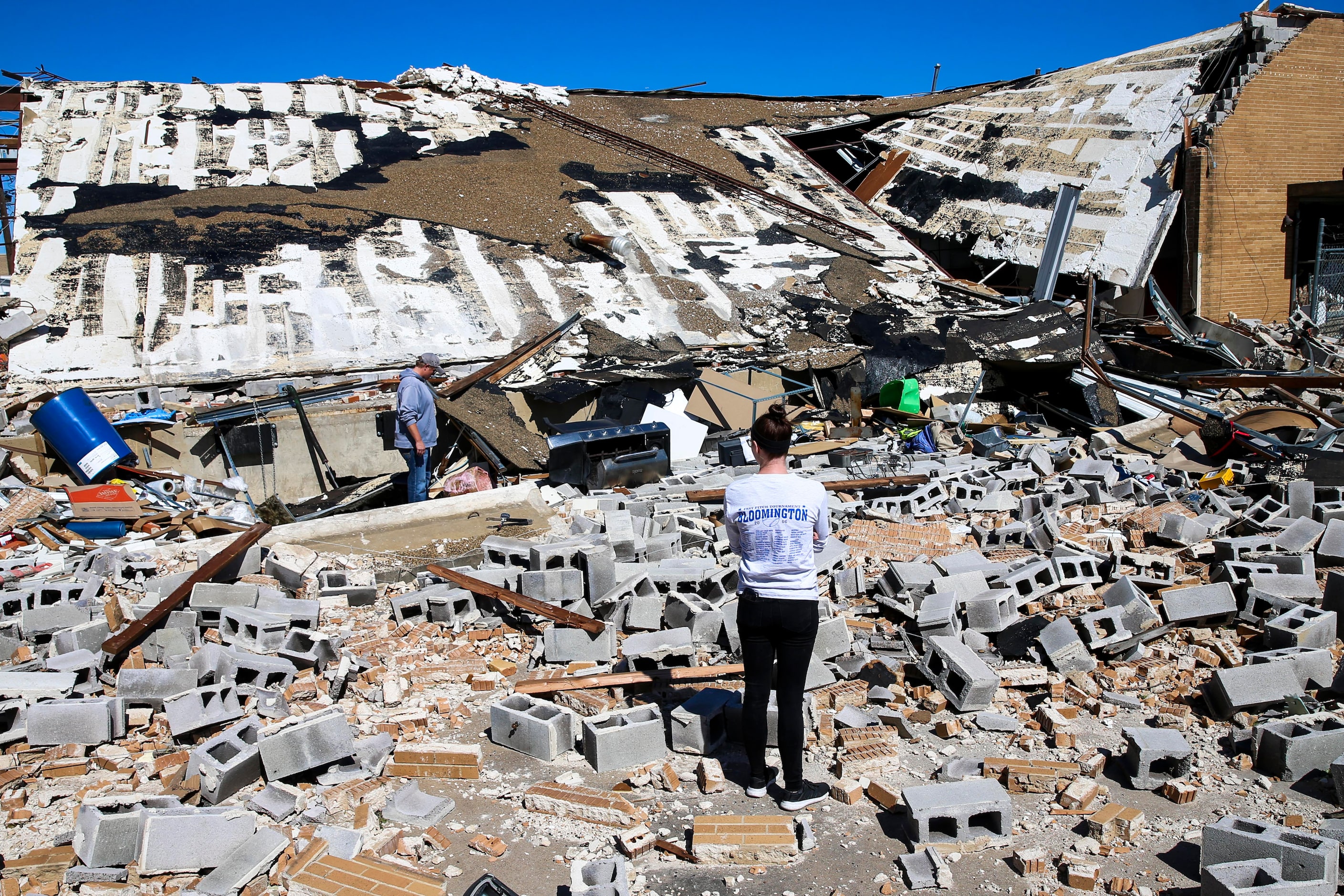 Nicole Abbis, left, looks through the debris with Nicci Roedel on Monday, October 21, 2019...