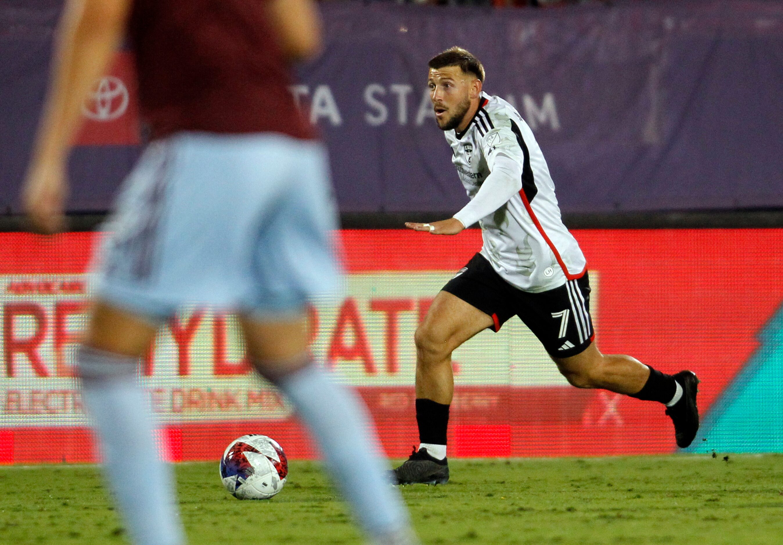 FC Dallas midfielder Paul Arriola (7) drives against the Colorado defense during first half...