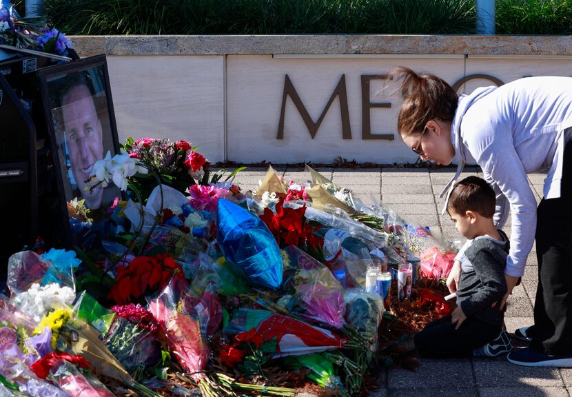 Michael Richard Casco and his mother, Katie Casco, shared a moment in front of the memorial...