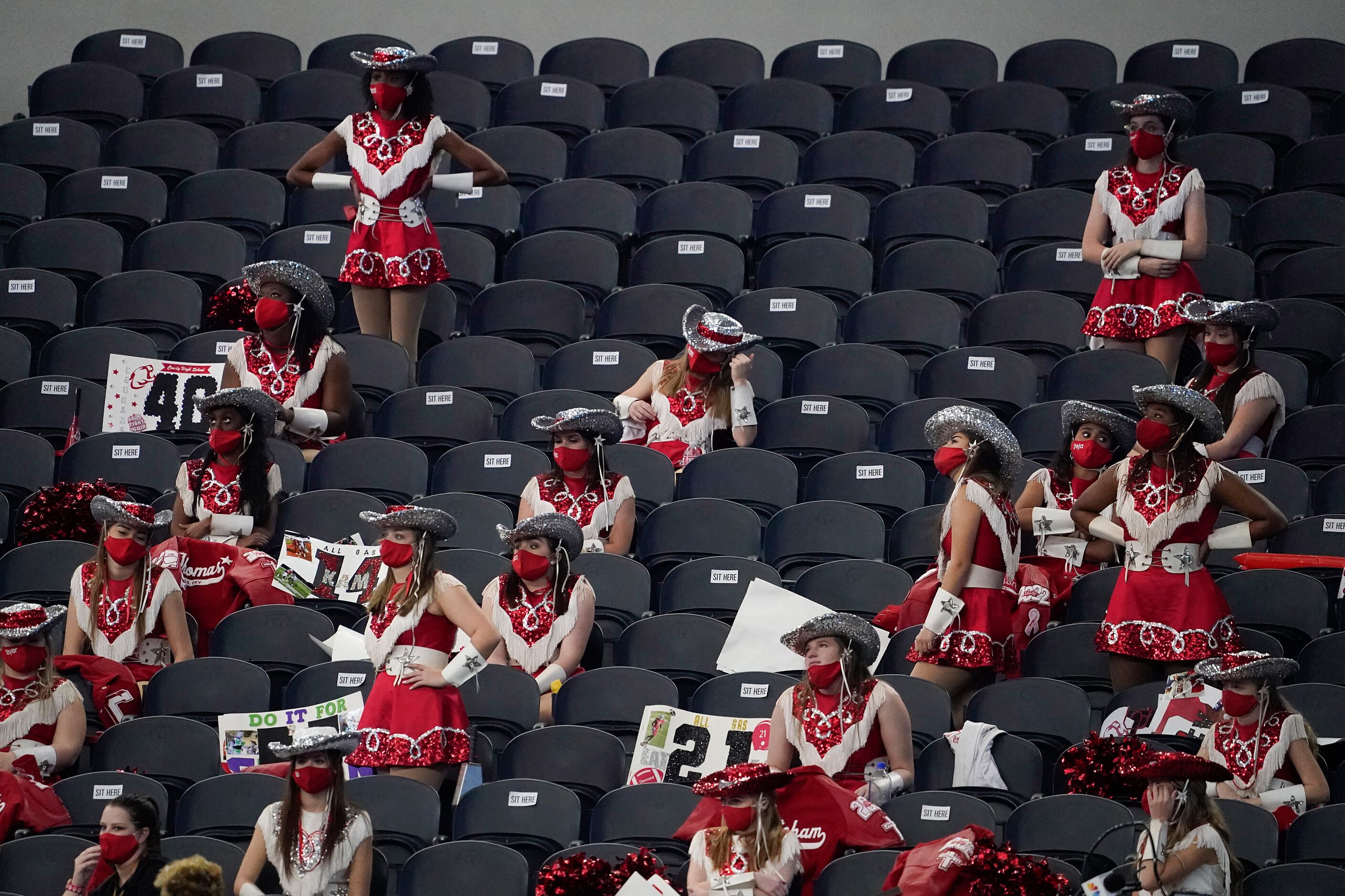 Crosby drill team members watch during the second half of a 56-21 loss to Aledo in the Class...