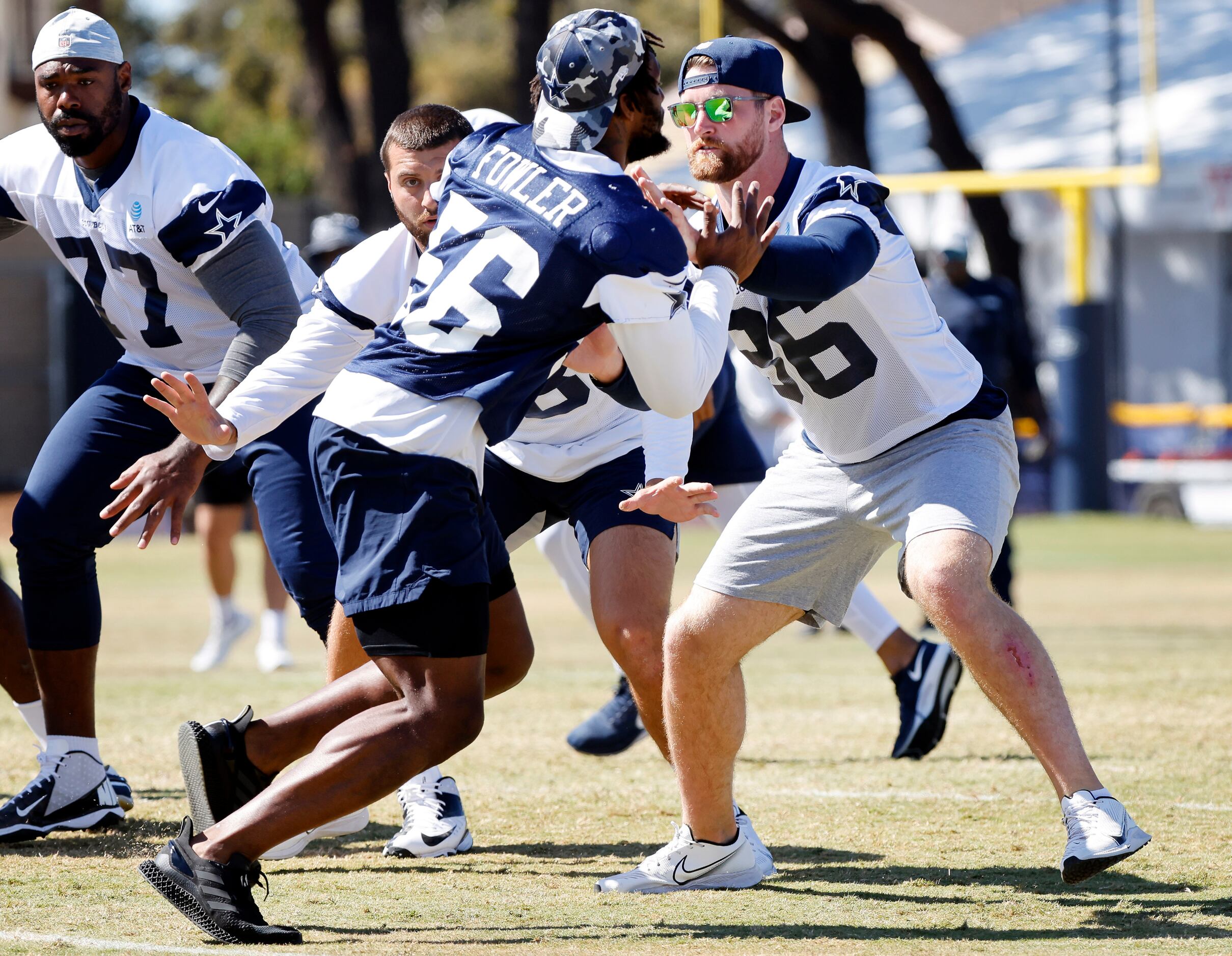 Dallas Cowboys tight end Dalton Schultz (86) blocks defensive end Dante Fowler (56) during a...