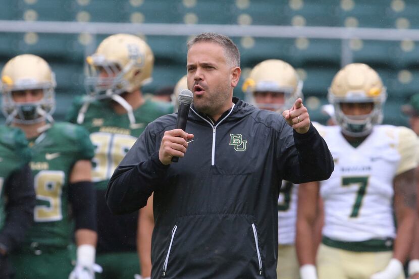 Baylor head coach Matt Rhule talks to players and fans before the start of their their...
