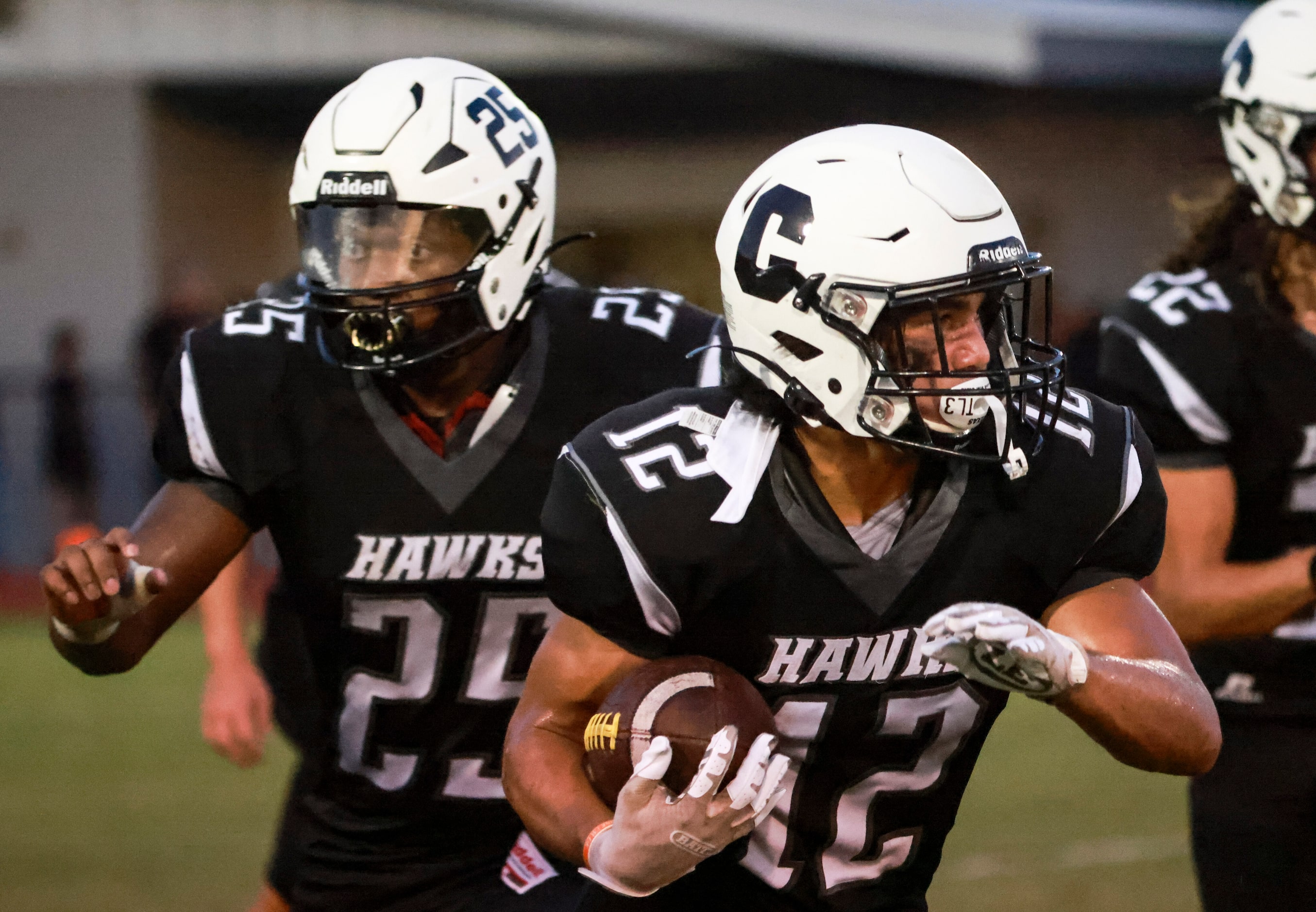 Cistercian Preparatory School JP Roppolo (12) runs the ball up the field during the football...