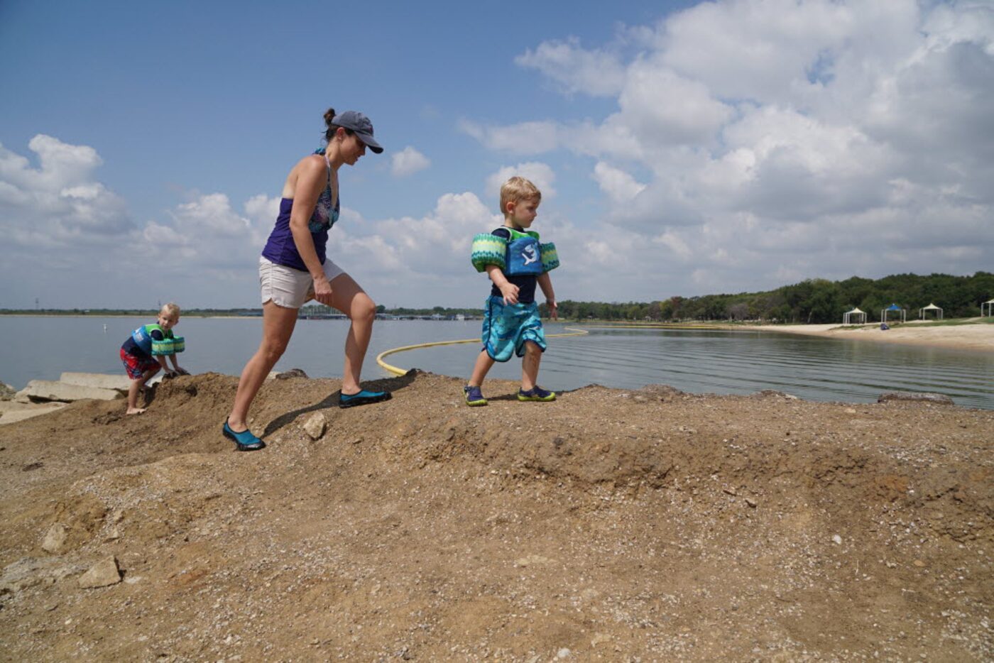 Natalie Jansen and sons Jacob (left) and Eli got an early start on Labor Day weekend Friday...