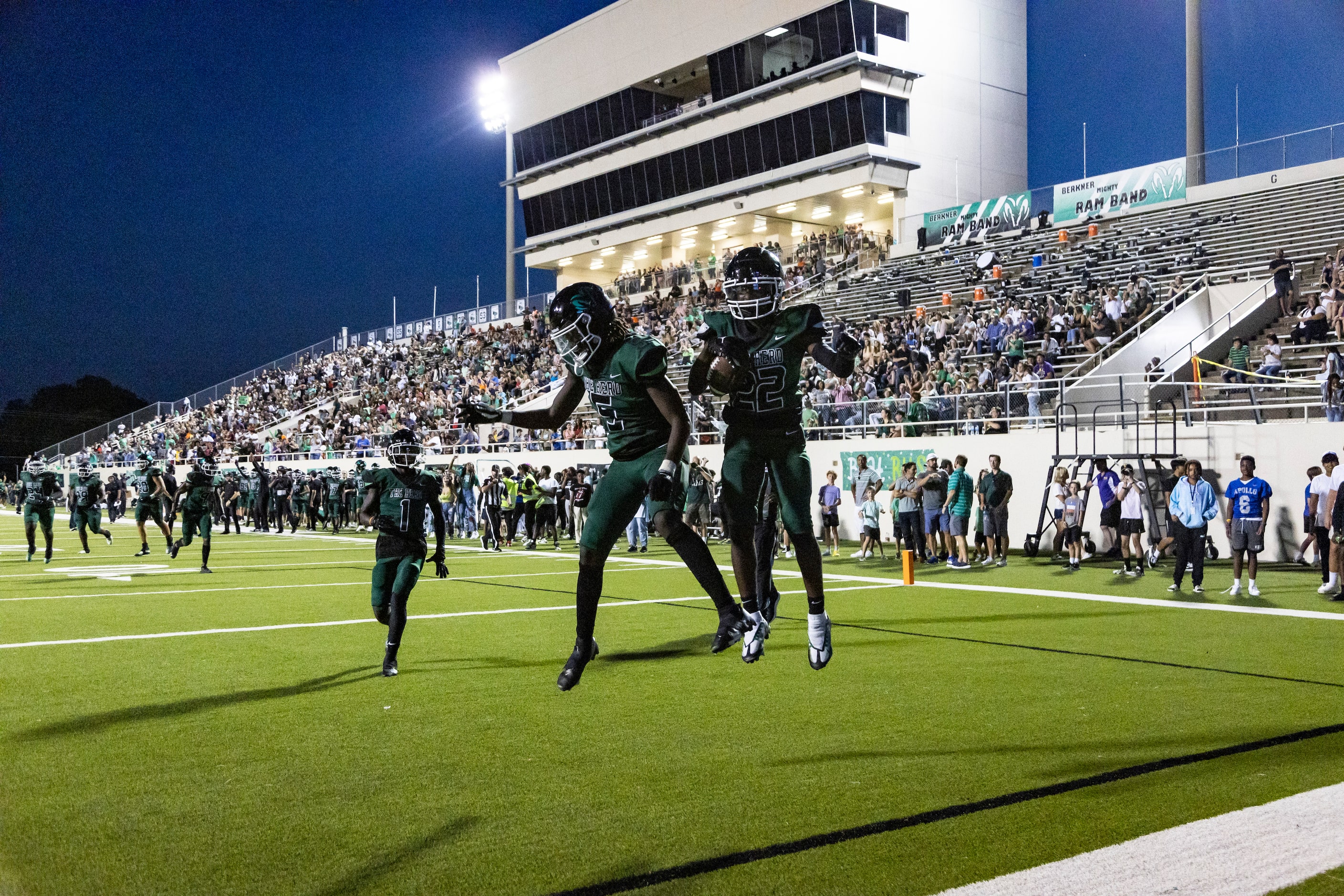 Berkner freshman wide receiver Dameon Crowe (22) celebrates with senior wide receiver Tre...