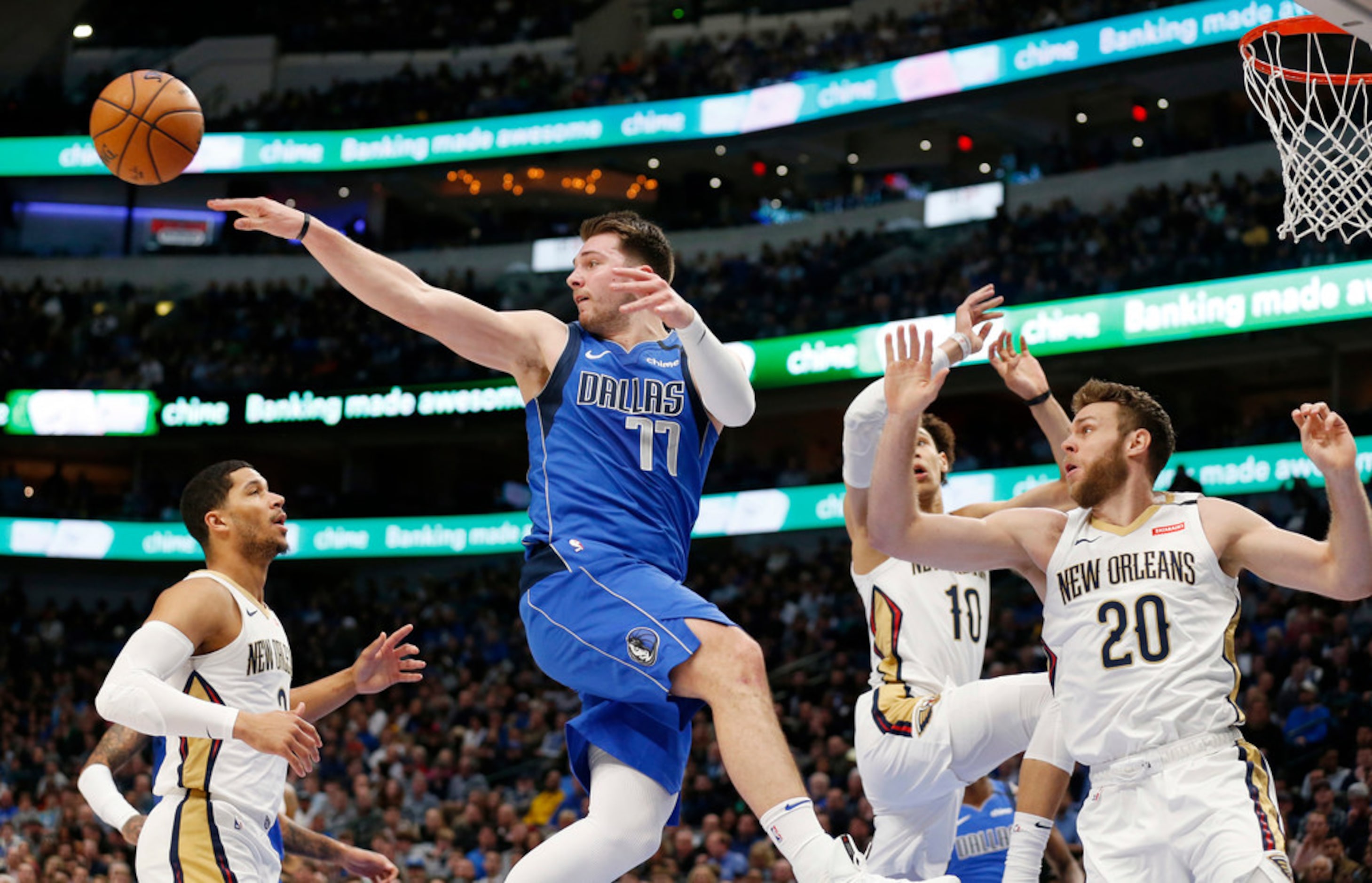 Dallas Mavericks guard Luka Doncic (77) passes out as New Orleans Pelicans center Jaxson...