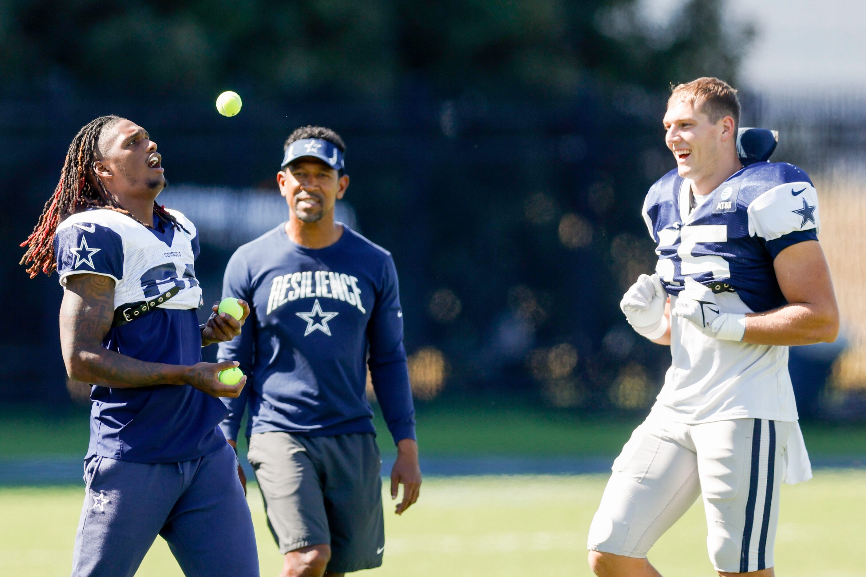 Dallas Cowboys wide receiver CeeDee Lamb (88) juggles tennis balls to the amusement of...