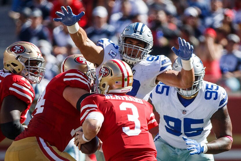 Dallas Cowboys defensive end Tyrone Crawford (98) applies pressure to San Francisco 49ers...