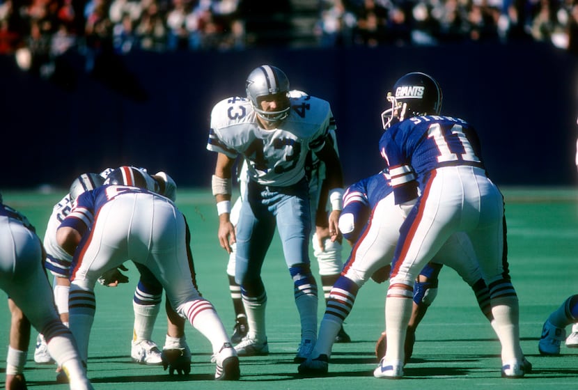 Defensive back Cliff Harris #43 of the Dallas Cowboys looks to blitz quarterback Phil Simms...