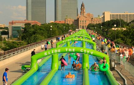 Slide the City participants ride down (or sometimes walked) until the slide ended in a big...