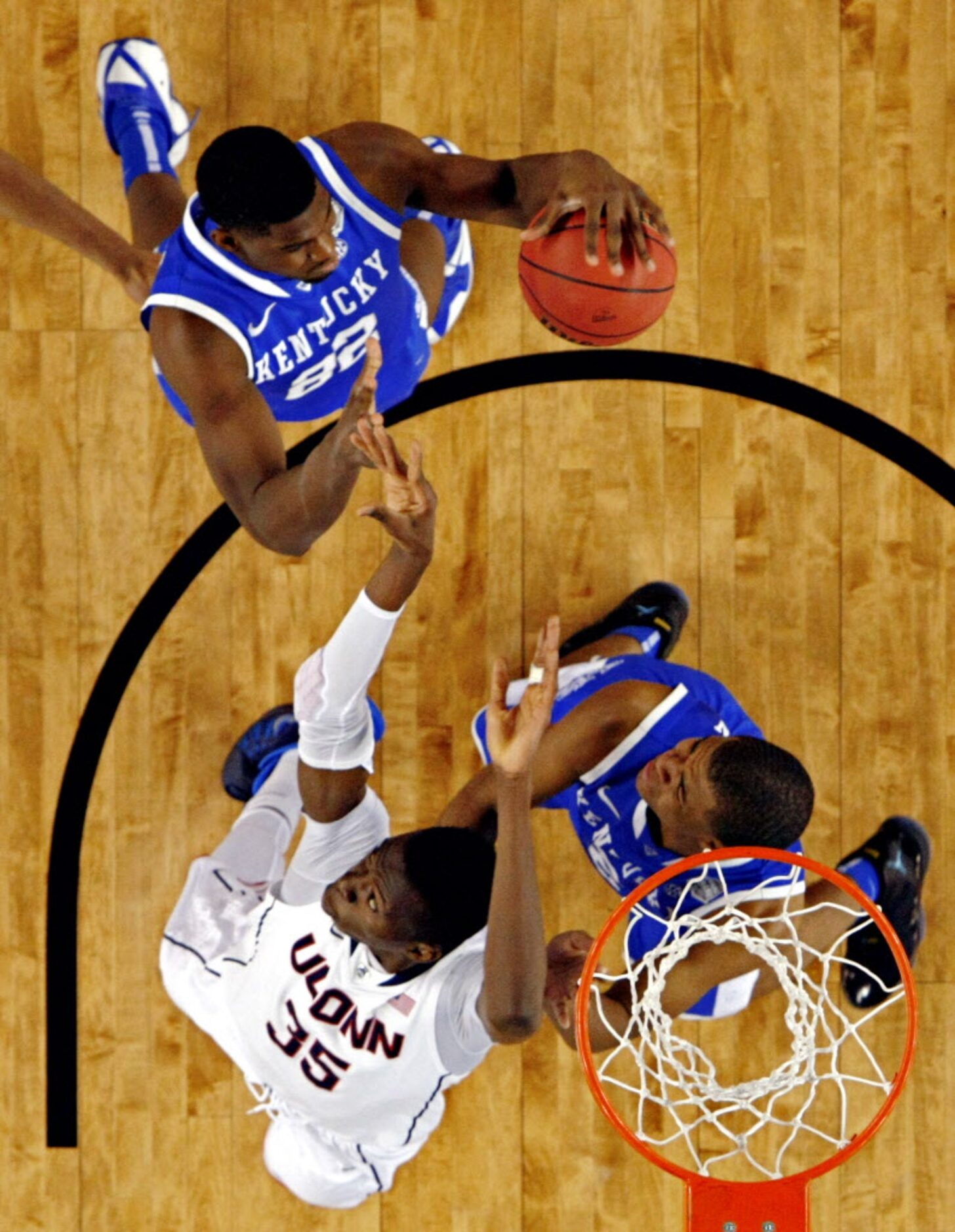 Kentucky Wildcats forward Alex Poythress (22) comes up with a rebound missed by Connecticut...