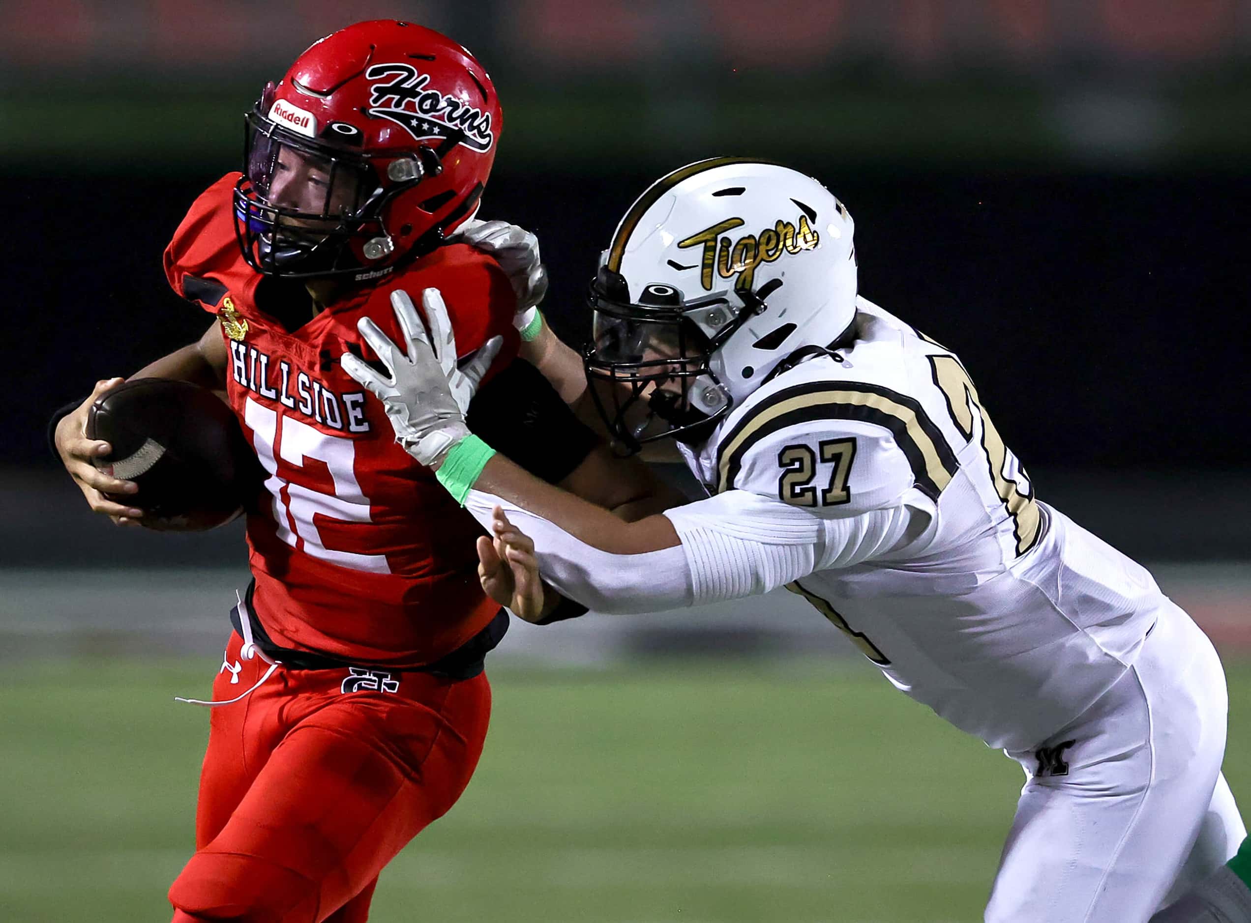 Cedar Hill quarterback Anthony Edwards (12) gets pushed out of bounds by Mansfield...
