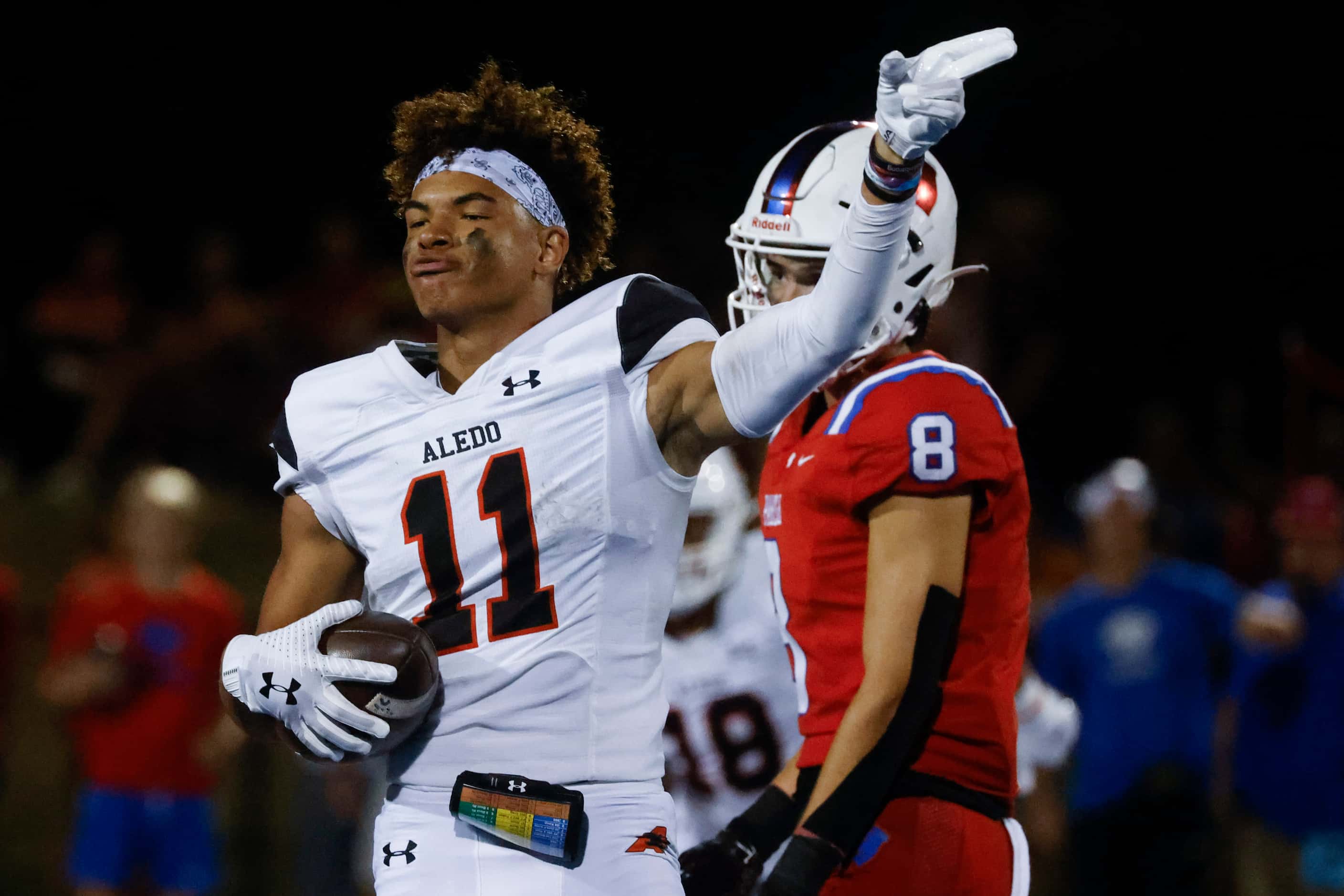 Aledo High’s Jalen Pope (11) celebrates after completing a pass during a season-opening...