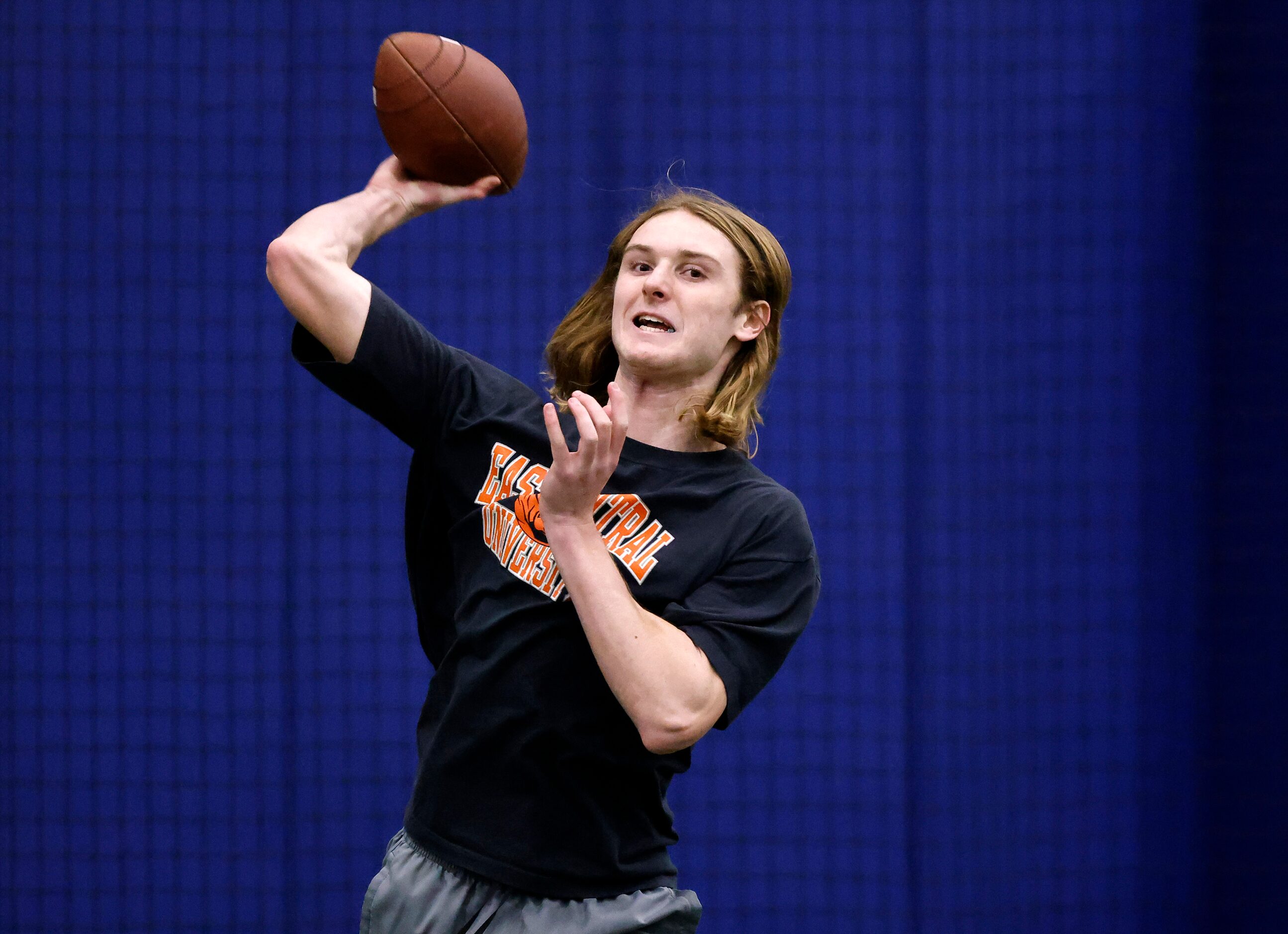 Unsigned senior quarterback River Medlin of Community High School throws a deep pass before...