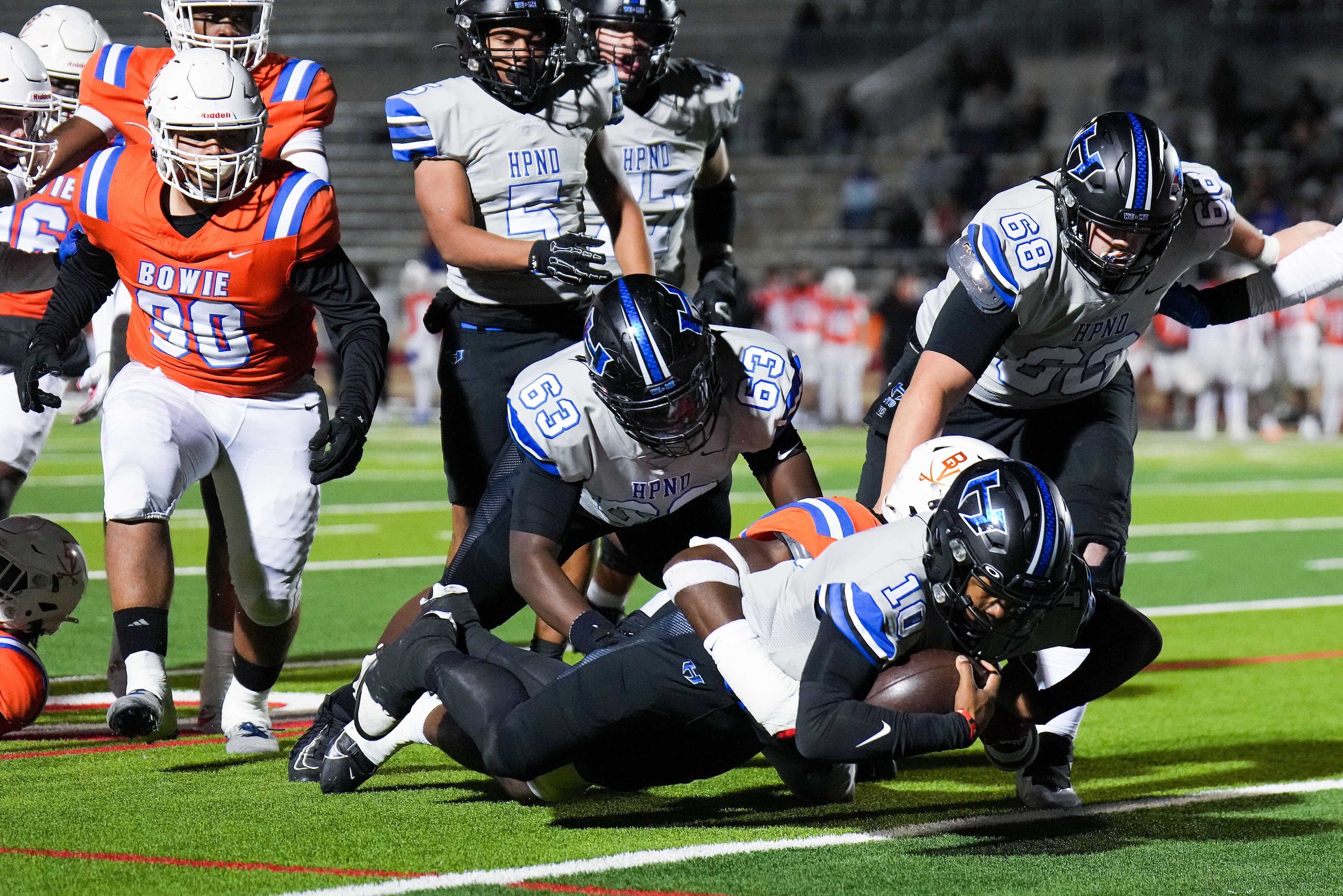 Hebron quarterback Patrick Crayton Jr. (10) dives to come up just short of the end zone...