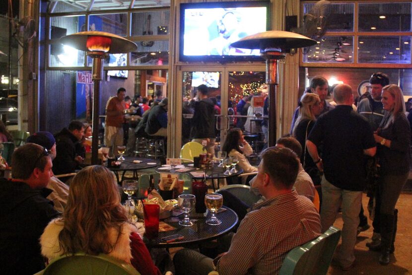 At Katy Trail Ice House, there are TVs inside and a couple in the backyard.