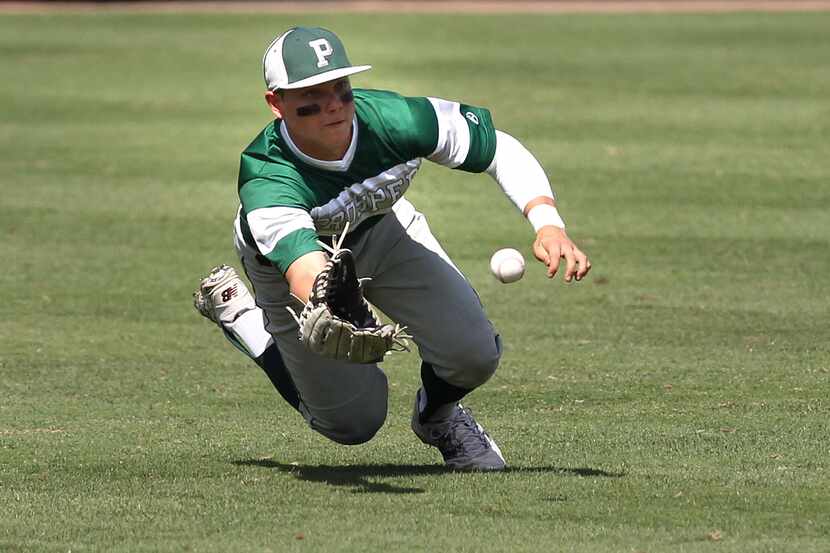 FILE - Prosper's Steele Walker makes a diving grab in center field against Tomball during...