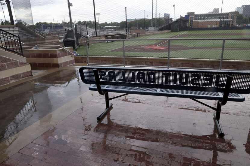 A bench at Jesuit's baseball diamond sits empty moments before Game 2 of the Jesuit versus...